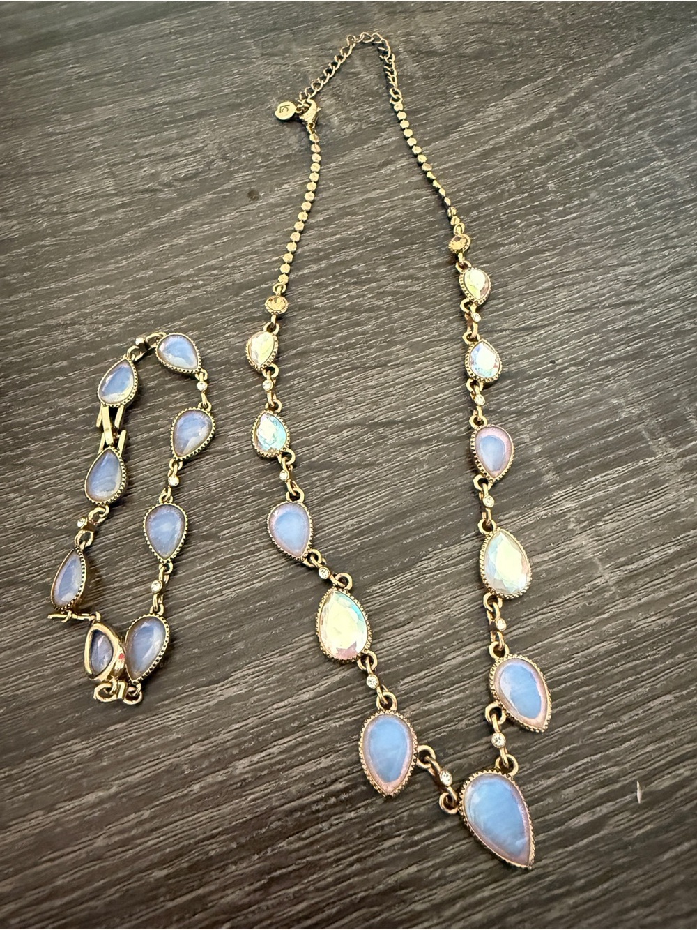 Liz Claiborne Gold tone iridescent opalescent necklace, and bracelet set.